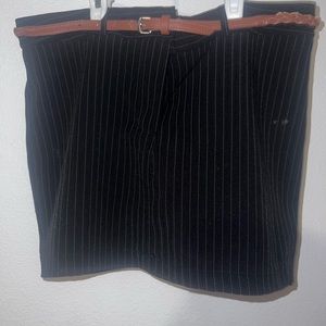 Large black shirt with white pin stripes and brown leather belt.